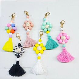 Wholesale of new silicone solid Colour cow bead keychains for foreign trade, pure handmade woven tassel bags and pendants