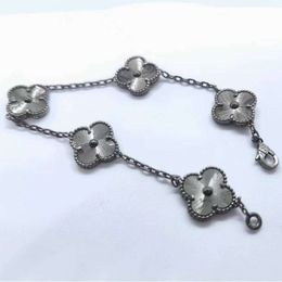 vanity case nail four van clover cleaf braceletNew Four Leaf Grass Five Flowers Black Gold Laser Bracelet Female 18 Double Sided Clavicle Chain Natural Fritillar