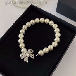 Designer miumiu bracelet Miao Family Girl Heart Bowknot French Pearl Bracelet Womens Versatile Jewellery Summer New Light Luxury Beaded Chain