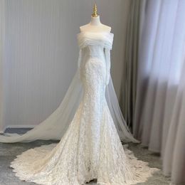 Off Schulter Meerjungfrau Brautkleider mit Tulle Zug 2024 Designer Langarm Spitzenkleider Vestido Novia Perlen Applikationen Braut afrikanisches Brautkleid