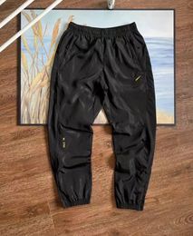Мужские и женские водонепроницаемые комбинезоны с логотипом NK X NOCTA, повседневные брюки с карманами и 3D вырезом, брюки для бега, длинные брюки
