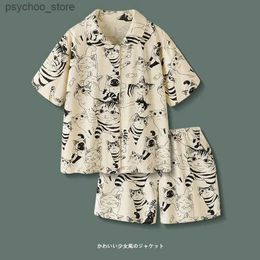 Men's Tracksuits Summer mens and womens pajamas cute short sleep short sleeved cat retro cartoon style new loose plus size set lazy home clothing Q240314