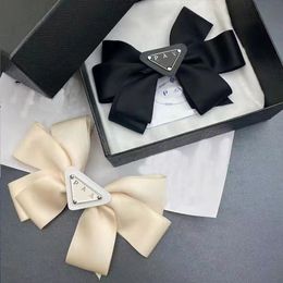 PRA hair clip with cloth label P letter milky white heavy industry bow spring clip beautiful fairy hair clip