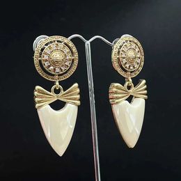 Dangle Chandelier European and American Mediaeval vintage round with bow and white water droplet pendant earrings 24316