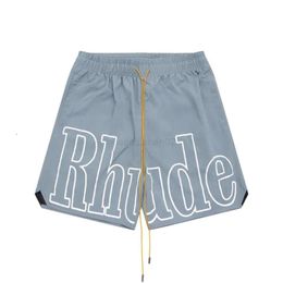 Дизайнерские шорты Rhude Shorts Летняя мода Пляжные брюки Мужчины Высококачественная уличная одежда Красный Синий Черный Фиолетовый Брюки Мужские шорты Us Siize S-xl 29th6