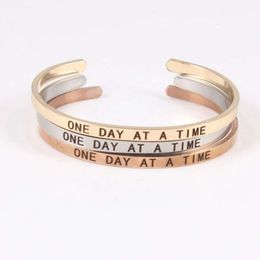 ONE DAY AT A TIME Stainless Steel Engraved with Indelible and Inspirational Opening Bracelet