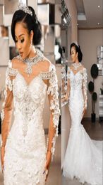 2021 Gorgeous Mermaid Wedding Dresses Jewel Neck Illusion Lace Appliques Crystal Beads Long Sleeves 3D Floral Flowers Chapel Train2661866