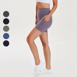 AL Solid color nude yoga shorts with side pockets, high waist and hip lifting, tight and elastic training, sports hot pants for women