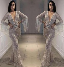 Sparkly Silver Prom Dresses Bling Bling Sequined Mermaid Evening Gowns Deep V Neck Long Sleeves With Tassel Arabic Formal Party Dr9171619