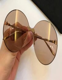 Luxury 0353 Designer Sunglasses For Women Fashion Sunglasses Wrap Sunglass Frameless Coating Mirror Lens Carbon Fibre Legs Summer 2444814