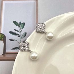 new 2024 diamond studded four leaf clover pearl earrings for female niche design highend and light jewelry earrings elegant style