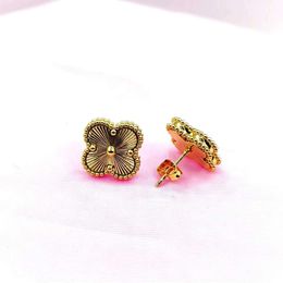 Style New High End Fanjia V Gold Lucky Clover Flower Fashion Versatile Colorless Earrings ersatile