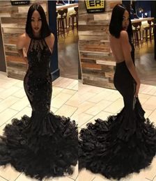 2022 Black Girl Sexy Backless Mermaid Long Prom Dresses Halter Illusion Tulle Applique Beaded Feather Layers Sweep Train Evening G6819064