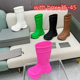 Luxurys longo tubo de borracha joelho botas altas designer botas de chuva mulheres solas grossas cabeça redonda anti deslizamento solas grossas botas de chuva altas elegantes e versáteis