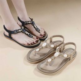 Yeni Yaz Sandal Konforlu Leisure Plaj Ayakkabıları Düz ​​Roman Tarzı Sandalet Topuk Ayakkabıları Flip Flops Kadınlar Sandles Heels 240228