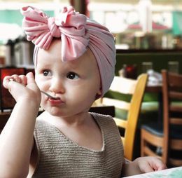 New 16Colors Baby Girls Cotton Fabric Solid Turban 2019 American Style Kids Pretty Bow Hat Autumn Winter Childrens Warm Soft Hat9457755