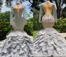 2023 Full Bodice Rhinestone Prom Dresses VCut Neckline Open Back with Lower Zipper Closure Feather Train Mermaid Evening Gown BC17352634