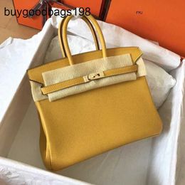 Designer Bags Womens Handbags Tote Bag 2024 New Style Family Lychee Pattern Togo Leather Wax Thread Sewing Brides Lock Button Hand Have Logo A27y