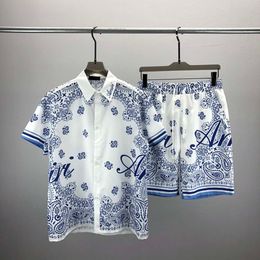 23SS Mens Designers Tracksuit Luksusowe klasyczne modne koszule Hawajskie koszule dresy śladowe szorty z nadrukiem Koszulka krótkie rękawy #047