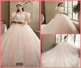 2020 new arrival champagne lace ball gown wedding dress exquisite princess puffy short sleeve sexy bridal gowns court train bride 6569361