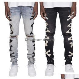 Jeans da uomo di alta qualità 2024 Mens buco strappato elastico stampato con stampa di ossa stile di tendenza consegna di abbigliamento abbigliamento Dhcu2