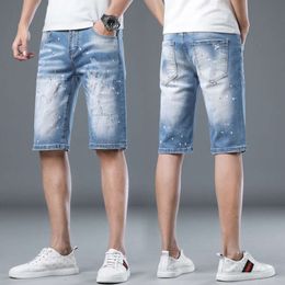 2022 Summer New High End Perforated Ink Splatted Denim Shorts for Men's Light Luxury Fashion Brand Five Point Korean Edition Trendy Horse Pants