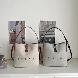 French New Canvas Bag Bamboo Joint Bag Water Bucket Bag Commuter Versatile One Shoulder Crossbody Handbag Women beach Tote Bag 25*25*12