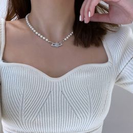 Designer necklace, classic Saturn pearl necklace, women&#039;s irregular Baroque clavicle chain, niche design, European and American necklace