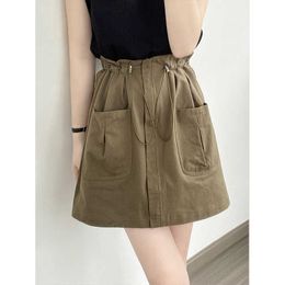 Yan shuang americano cordão flor bud cintura elástica saia curta 2024 verão novo grande bolso workwear saia 9698