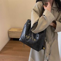32% OFF Designer bag 2024 Handbags personalized metal letter chain drawstring pleated backpack with stylish large capacity solid color womens