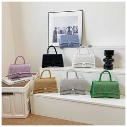 Designer bag 2024 Handbags Product Full Handheld Straddle Fashion Handheld Popular on the Net Same Style Hourglass Spicy Girls
