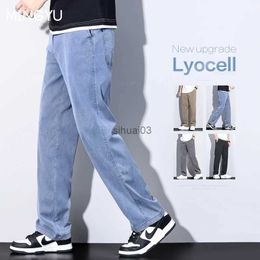 Men's Jeans New summer clothing new soft Lyocell fabric jeans mens blue elastic waist loose straight thin denim mens plus size 5XLL2403