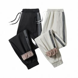 2022 pantaloni invernali caldi in pile sciolti da uomo pantaloni larghi casual da jogging abbigliamento sportivo Plus Size 8XL pantaloni sportivi in pile spesso caldo per uomo n5To #