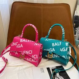 24% OFF Designer bag 2024 Handbags Trendy Handheld Letter Printing Hourglass One Shoulder Crossbody Womens Small Letter Graffiti Underarm Small