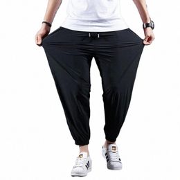 Pantaloni casual da uomo in seta di ghiaccio ad asciugatura rapida estivi Pantaloni a nove punte elastici ultrasottili Pantaloni larghi con piedi a fascio solido 7XL g2oO #