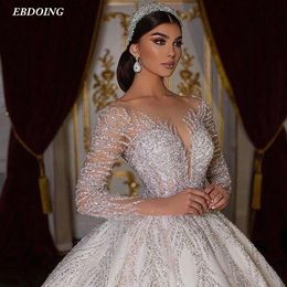 Illusion Long Sleeves Sparkle Ball Gown Wedding Dress With Long Open Back Deep Sweetheart Neckline