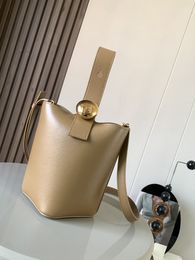 The bucket handbag cleverly blends pure minimalist lines with eye-catching design style