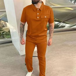 Fashion two-piece mens casual pocket short sleeved polo shirt and pants set mens Tracksuits solid color casual set mens 240326