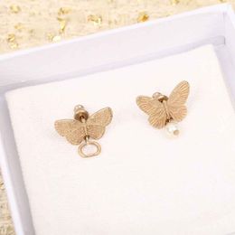 Designer Jewellery Luxury quality double butterfly shape stud earring with nature shell beads in 18k gold plated have stamp box PS3308B