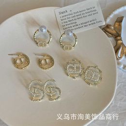 D family Earrings CD Dijia letter pearl studded Earrings 925 silver needle French star same small fragrance