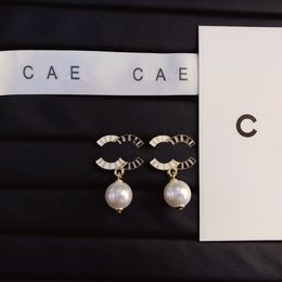 Orecchini in bianco e nero orecchini placcati in oro con gioielleria di alta qualità design a sospensione orori di gioielli squisiti progettati per feste di compleanno da donna oro
