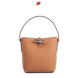 Factory Source High Quality Handbags Is 2024 Bamboo Button Bag Head Layer Litchi Pattern Cowhide Small Water Bucket Single Shoulder Crossbody