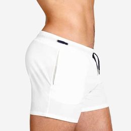 Men's Shorts European and American solid Colour beach three point shorts fashionable and simple triangular mesh lining swimming sports and fitness shorts J240328
