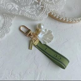 Designer keychain Luxury key chain bag charm female car key ring Pearl charm green ribbon delicate shells keychain couple pendant gift nice good