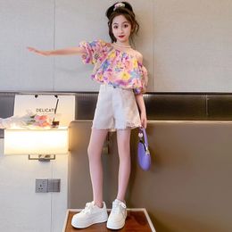 Childrens Floral Short Sleeved Fringe Shorts Twopiece Set For Girls Fashionable Suspender Top Casual Summer Clothing 240323