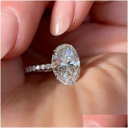 With Side Stones European American Fashion Sparkling Oval Diamond Engagement Ring Elegant Cubic Zirconia Paved Copper Brass 925 Sier Dhrev