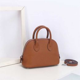 Shoulder Bags 2024 New 18cm Shell Wrap Head Layer Cowhide Litchi Pattern Mini Bowling Ball Handheld Genuine Leather Womens Crossbody Bag