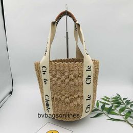 Original Chlee Summer new simple and generous womens bag woven shoulder hand bucket Tote straw beach 6WO1