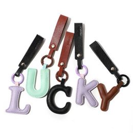 Keychains Lanyards Hot Creative PU 26 Letter Keychain Letter Car Key Accessories Business Keyholder Womens Bag Pendant Key Decoration J240330