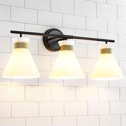 Stylish WOSHITU 4-Light Mid Century Modern Vanity Lights for Bathroom Over Mirror - Black and Gold Wall Sconce Lighting with Frosted Milky Glass